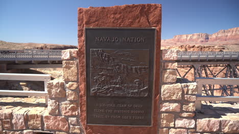Navajo-Nation-Board-by-Historic-Bridge-and-Glen-Canyon-Dam,-Arizona-USA