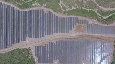 Aerial-top-down-of-large-solar-panel-park-in-exotic-suburb-area-of-Dominican-Republic
