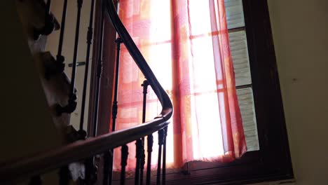 Slow-establishing-shot-of-a-wooden-staircase-within-a-villa-in-Pignan,-France