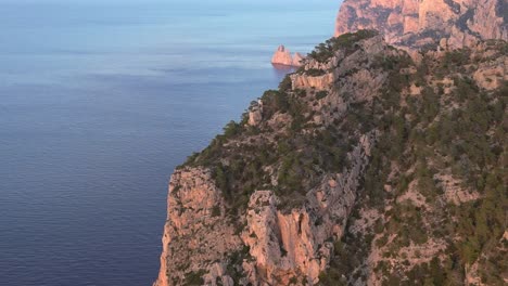 Ibiza-seaside-cliff-basking-in-warm-glow-of-sunset