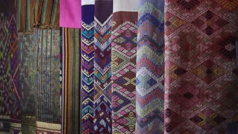 colorful-fabrics-for-sale-at-night-market-in-Luang-Prabang,-Laos-traveling-Southeast-Asia