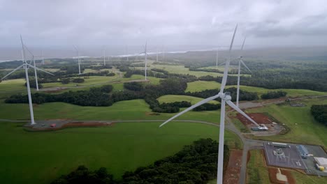 Close-up-drone-view-of-spinning-wind-turbine-propellers-at-Tasmanian-wind-farm,-Australia