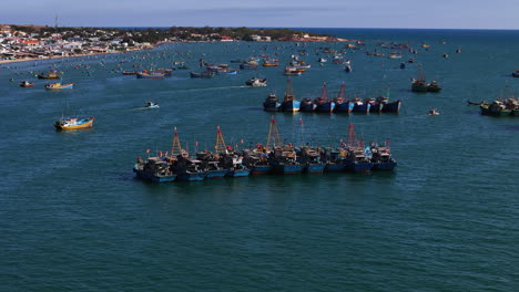 Vietnamese-Commercial-Fishing-Fleets-Sitting-Idle-In-Mui-Ne-Fishing-Village,-Phan-Thiet,-Vietnam