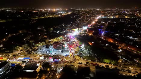 Panoramic-aerial-of-flashing-lights-at-night-during-Gran-Marcha-Carnaval-Parade