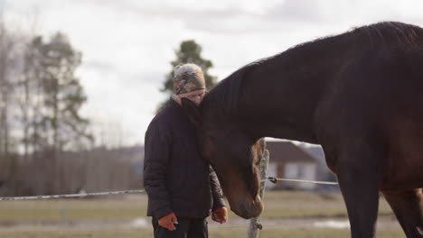 Horse-initiates-physical-interaction-with-woman-during-equine-assisted-therapy