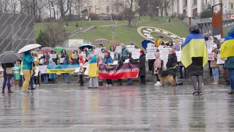 Supporters-gather-to-show-support-for-the-demobilization-of-soldiers-in-city-on-rainy-day