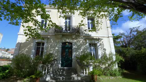 Slow-establishing-shott-of-a-stone-villa-in-Pignan-with-a-beautiful-garden