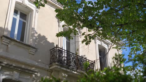 Slow-establishing-shot-of-multiple-windows-and-a-balcony-on-a-villa-in-Pignan