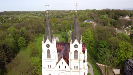 Exterior-Facade-And-Towers-Of-Nativity-of-the-Virgin-Mary-Church-In-Orlova,-Czech-Republic