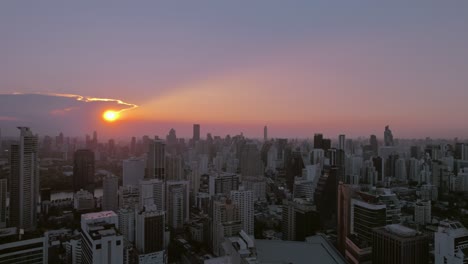 Aeria-shot-of-beautiful-skyline-of-Bangkok-city-during-scattering-of-sunlight-during-sunrise-in-Thailand