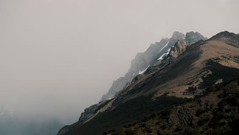 Hiking-Cerro-Torre-El-Chalten,-Snow-Covered-Peak,-High-Above-Mist-and-Clouds,-Argentina,-Establishing-Wide-Angle
