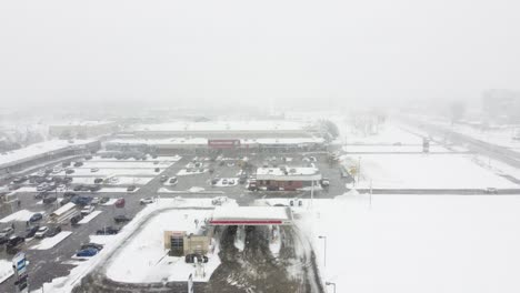 Drone-view-of-a-gas-station-in-a-winter-storm