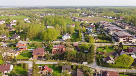 Cozy-village-of-Latvia-on-sunny-summer-day,-aerial-drone-view