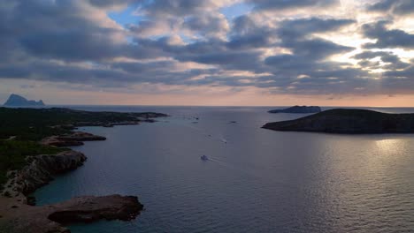 cloudy-sunset-seascape-with-island-silhouette