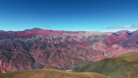 A-lateral-hyperlapse-captures-the-famous-and-iconic-Cerro-de-los-14-Colores,-known-as-'El-Hornocal',-in-Jujuy,-Argentina,-showcasing-its-vibrant-and-mesmerizing-multicolored-slopes