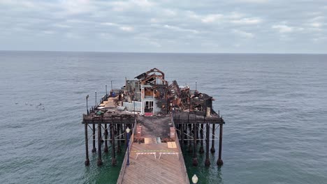 Oceanside-Pier-California-Fire-Damaged-Former-Rubys-Diner-Drone-High-And-Fast-Pass-of-the-Burned-Remains-of-Restaurant