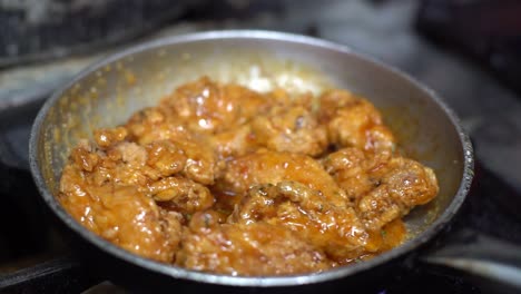 Cooking-chicken-pieces-in-a-frying-pan