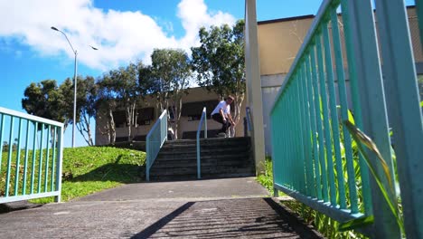 man-does-a-trick-on-to-the-hand-rail-in-hawaii