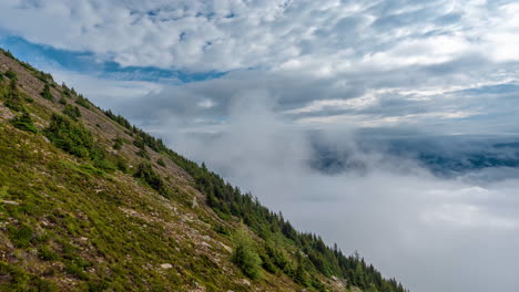 Timelapse,-Clods-and-Fog-Moving-Above-Mount-St