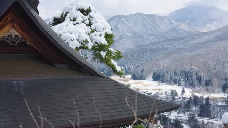 Japanese-Temple-Roof-and-Snow-Covered-Valley-Landscape-of-Yamadera
