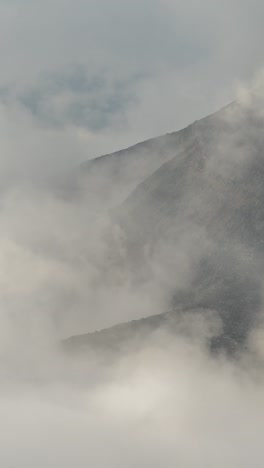 Vertical-4K-Timelapse,-Clouds-and-Fog-Moving-Around-Mount-St