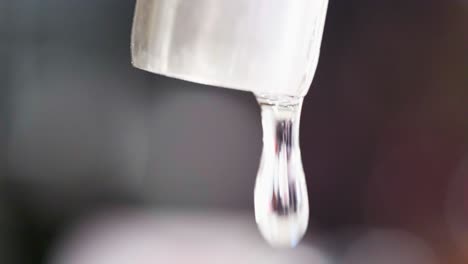 Close-up-macro-of-a-running-dripping-tap