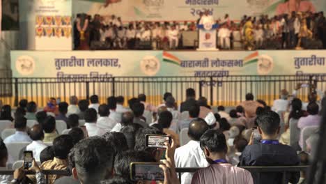 Indian-youth-capturing-Lok-Sabha-election-campaign-speech-by-Uddhav-Thackeray-and-Sharad-Pawar-at-college-ground-in-Warje
