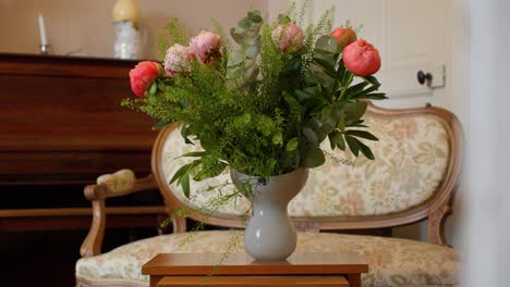 Slow-establishing-shot-of-vase-of-colourful-roses-on-display-in-a-antique-villa