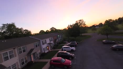 Row-of-houses-in-suburb-neighborhood-of-american-town-at-golden-sunset-time