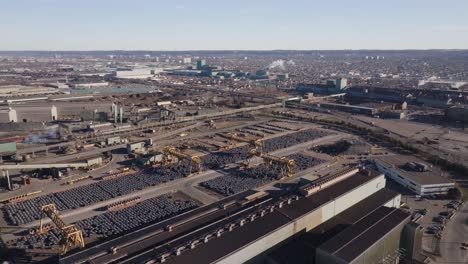 An-industrial-area-in-hamilton,-ontario-with-extensive-vehicle-storage-and-factory-buildings,-aerial-view