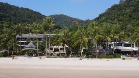 Aerial-View-Along-White-Sand-Beach-At-Koh-Chang-With-Palm-Trees-And-Beach-Front-Hotels