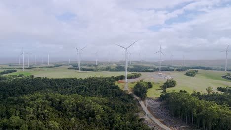 Green-energy-wind-farm-with-rotating-turbines-on-sunny-day-aerial-view-on-Tasmanian-west-coast,-Australia