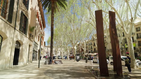 Sunny-day-at-Palma-de-Mallorca-bustling-city-street-with-pedestrians