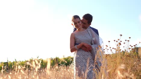 Happy-Indian-Couple-On-Their-Wedding-Day-Outdoors---Wide-Shot