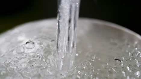 Close-up-macro-of-a-running-dripping-tap