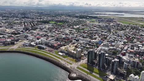 Reykjavik,-Iceland,-Aerial-View-of-Downtown-Buildings-and-Coastal-Traffic,-High-Rise-Drone-Shot