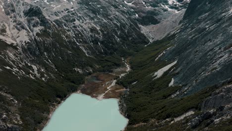 Turquoise-Glacier-Water-Lake-In-The-Mountain---Laguna-Esmeralda,-Ushuaia,-Tierra-del-Fuego-Province,-Argentina---Aerial-Drone-Shot