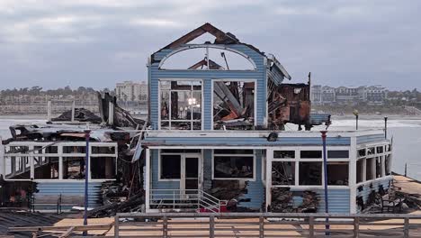 Oceanside-California-Pier-Fire-Damaged-Former-Rubys-Diner-Restaurant-Rear-Side-Vertigo-Style-Dolly-Zoom-Effect-Via-Drone