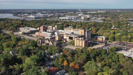 Aerial-drone-footage-of-Green-Bay,-Wisconsin-hospitals-with-Fox-River-and-tree-lined-streets