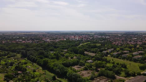 Aerial-landscape-of-small-European-town,-establishing-push-in,-Kalocsa,-Hungary