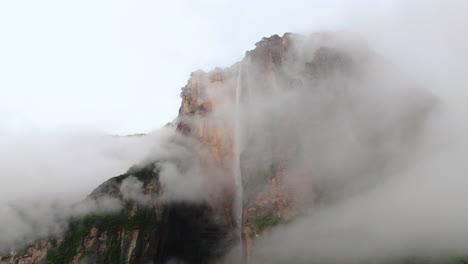 Morning-Clouds-Reveal-Angel-Falls-Over-Steep-Mountains-In-Bolivar-State,-Southeastern-Venezuela