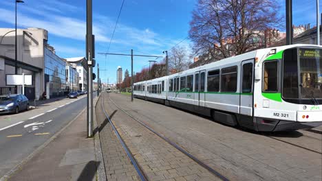 Urban-scene-of-tram-running-on-tramway-tracks-in-Nantes-city,-France