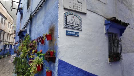 Chefchaouen-street-sign-in-multiple-languages-in-Morocco-medina