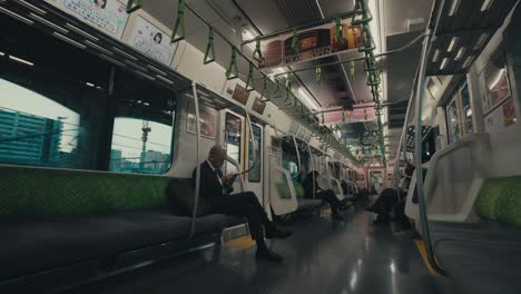 Few-Passengers-On-City-Subway-Train-In-Tokyo,-Japan,-Asia