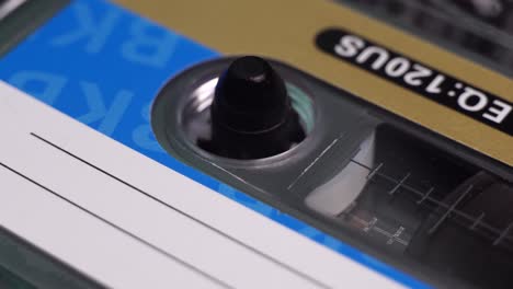 Close-Up-of-Audio-Cassette-Tape-Reel-Spinning-During-Playback-or-Recording