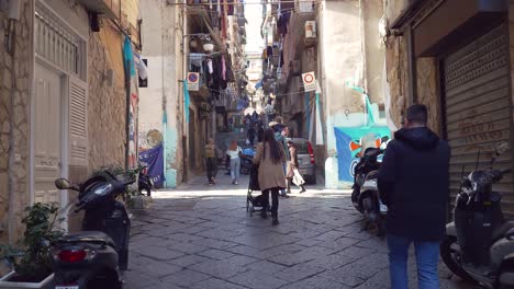 People-Walking-In-The-Street-Of-Quartieri-Spagnoli-In-Naples,-Italy