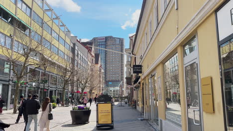 Shopping-Main-Street-Of-Södra-Förstadsgatan-With-Scandic-Triangeln-Hotel-In-The-Background-In-Malmo,-Sweden