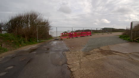 extra-wide-shot-of-beach-Rd-showing-its-fallen-over-the-Cliff-at-Happisburgh-in-March-2024