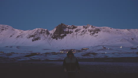 Iceland-tourist-walking-with-background-of-snowy-white-landscape-during-winter-season