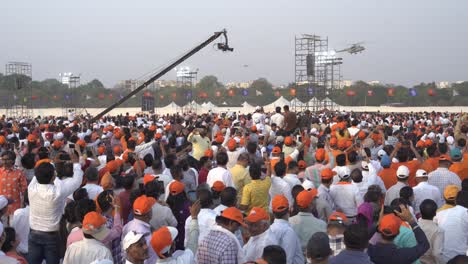 Supporters-cheering-up-Indian-Prime-Minister-Narendra-Modi-entering-in-a-helicopter-for-political-rally-of-the-Lok-Sabha-election-campaign